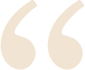 Elegant cream-colored quotation marks on a beige background.