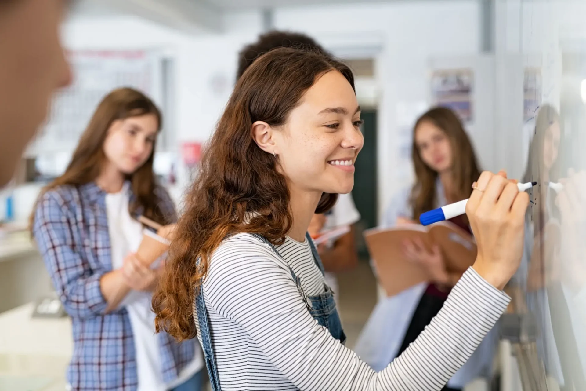 Young woman actively participating in a classroom activity.